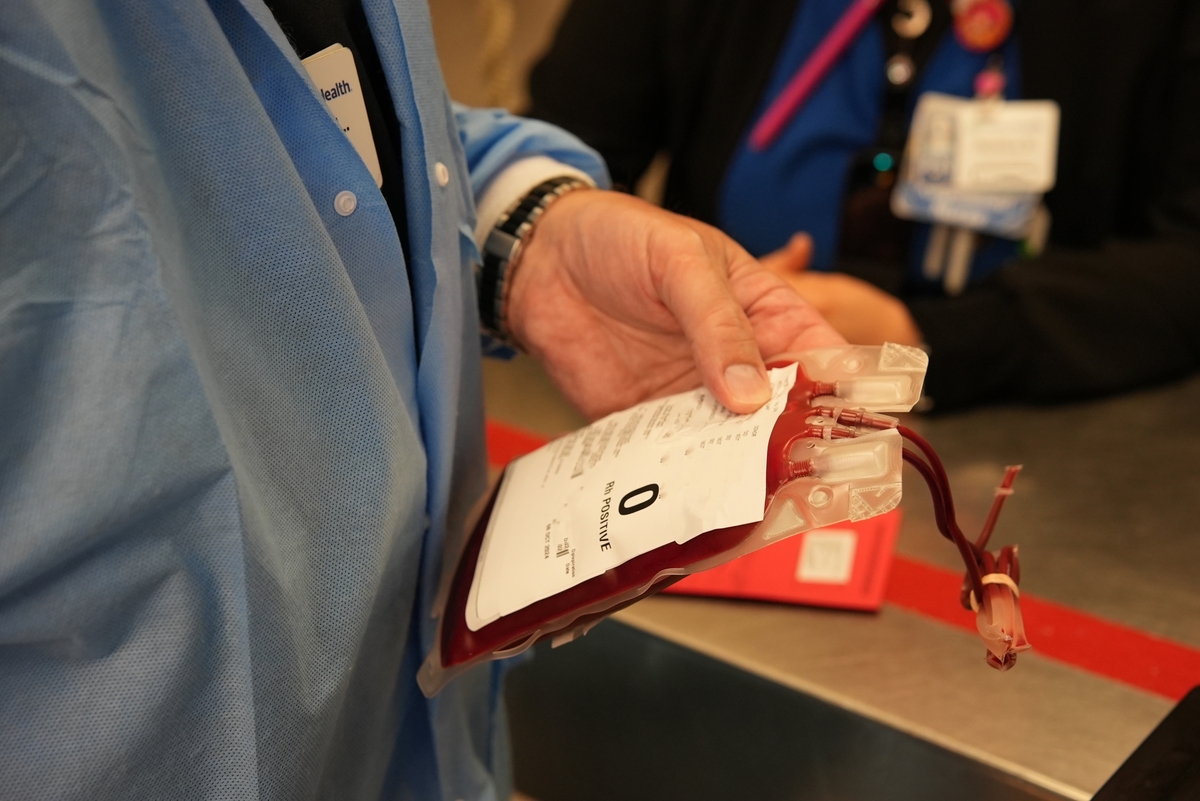 Lab staff with Type O blood sample