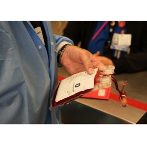 Lab staff with Type O blood sample