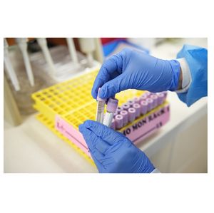 Lab tech with mutliple vials