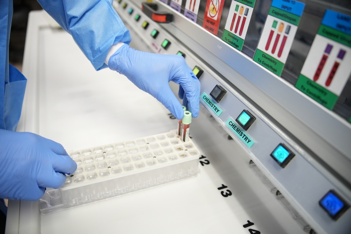Placing vials in container