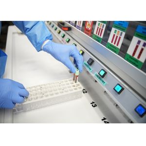 Placing vials in container