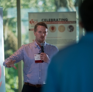 Kyle Spraberry speaks to crowd at Charleston Hard Hats with Heart Event