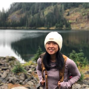 Jia Wu hiking by lake