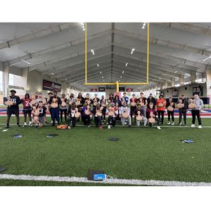 Group photo of participants at Senior Bowl who participated in Hands-Only CPR and AED training