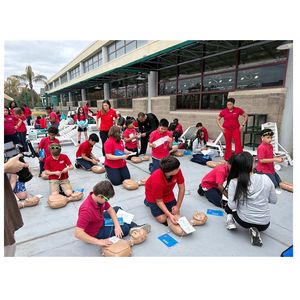 Hands-Only CPR practice at swim safety event