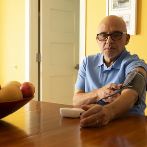 Carlo checking his blood pressure