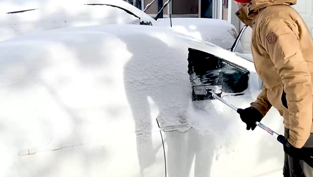 Clearing snow from car
