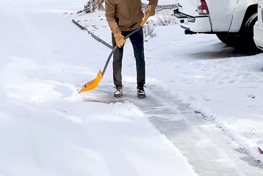 Snow shoveling driveway