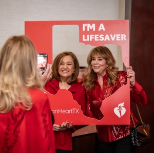  Women pose with Texas cutout and 'I'm a Lifesaver' sign