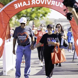 Stroke survivor crosses the Central Valley Heart and Stroke Walk finish line