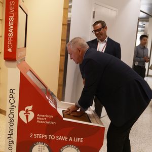 Bill Brennan practicing CPR