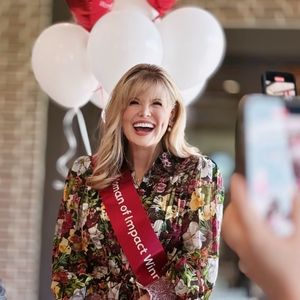 Regina Bruce poses as she is announced American Heart Association Go Red for Womens Dallas Woman of Impact winner