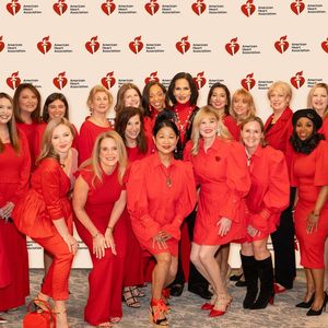 Regina Bruce poses with group of women at the National Go Red Day and Women of Impact Campaign kickoff luncheon