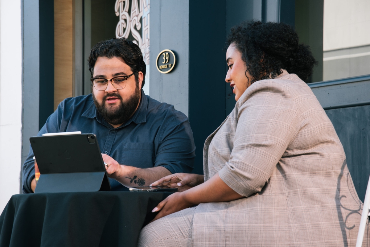 Man and woman looking at tablet