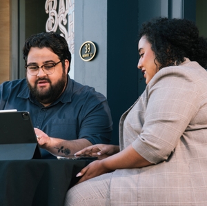 Man and woman looking at tablet
