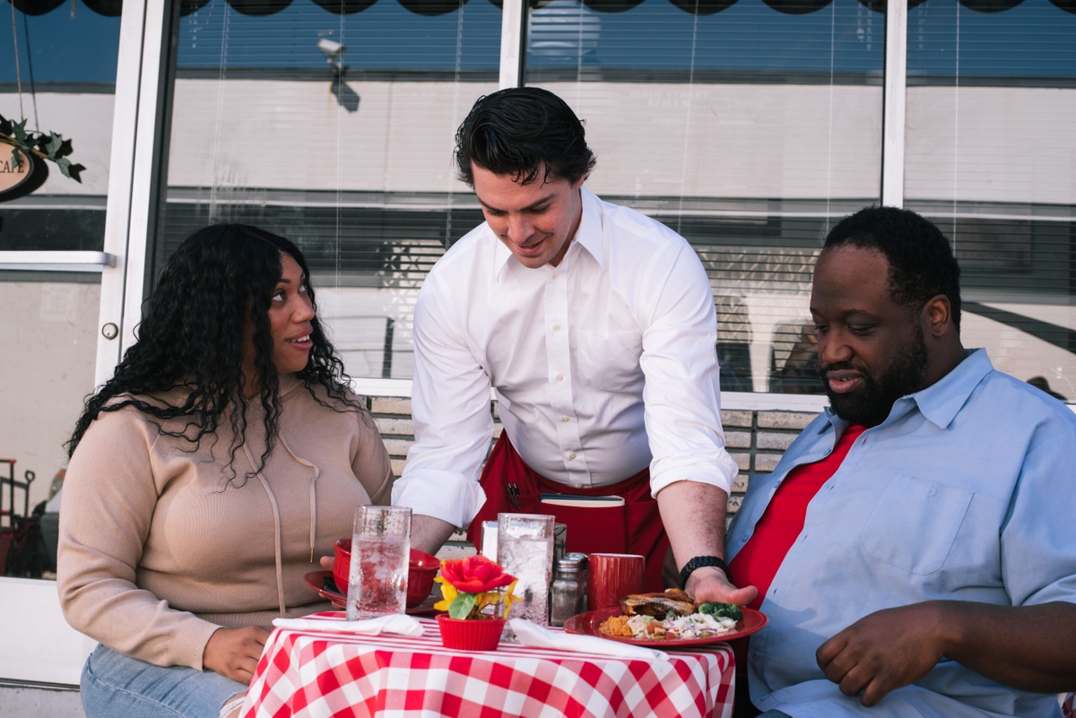 Couple eating at outdoor restaurant