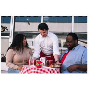 Couple eating at outdoor restaurant