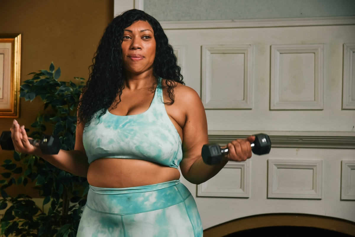 Woman exercising with dumbbells