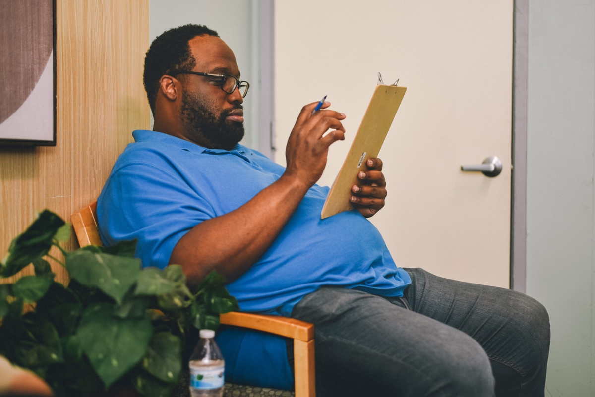 Man filling out medical forms