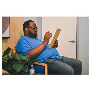 Man filling out medical forms