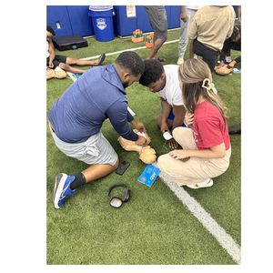 CPR training with Duke University football players