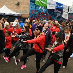 Walkers warm up before the Heart and Stroke Walk