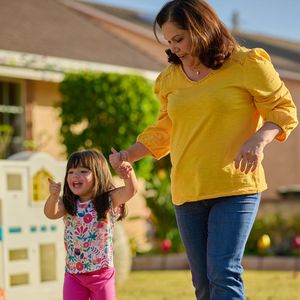 Erika Perez playing with granddaughter