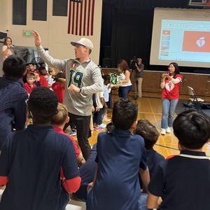 Seattle Seahawks Legend Bryan Walters greets kids
