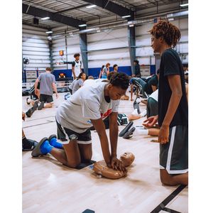 athlete practicing CPR