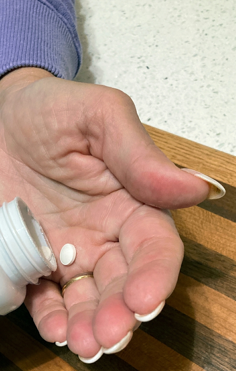 Melatonin in woman's hand