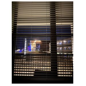 Building lights seen through window