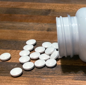 Melatonin bottle with loose pills