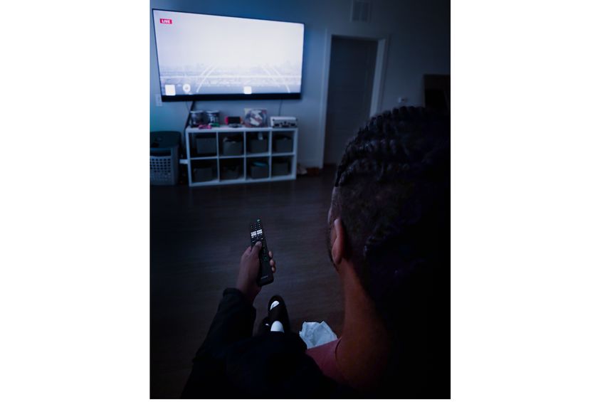 Photo | Man watching TV at night | American Heart Association