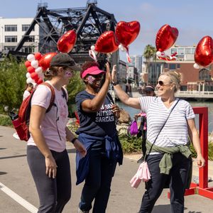 Walkers smile and high five at the 2025 San Francisco Heart Walk