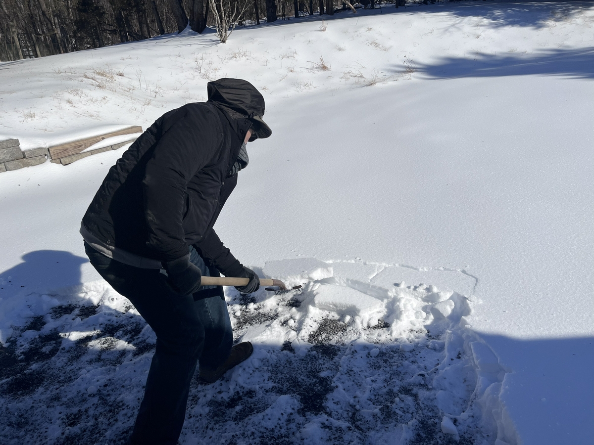 Clearing snow on driveway