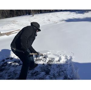 Clearing snow on driveway