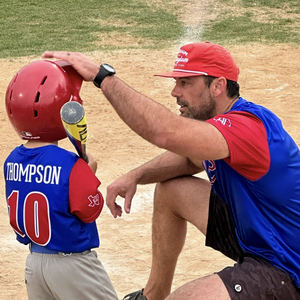 Cole Thompson coaches his son during a baseball game in Aledo