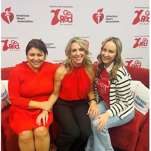 Go Red Couch Tour attendees on the red couch