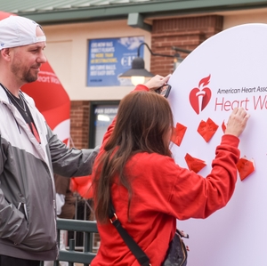 Participants place a heart in tribute to a loved one