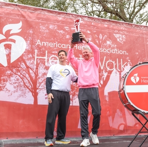 Michael Scarafile presents the Torch Journey trophy to Stuart Whiteside