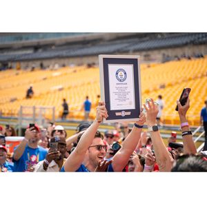 Doctor Mike holds up new Guinness World Record to crowd
