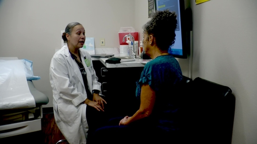 Finger stick - glucose test on woman