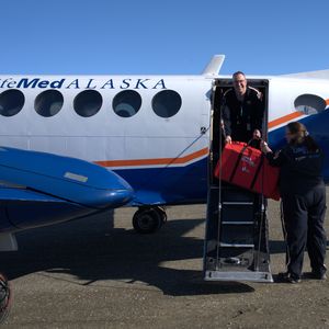 Loading CPR Kits into the plane
