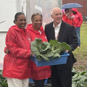 Dr Esa Davis Cheryl Beulah Ken Kozel pose with Bok Choy landscape