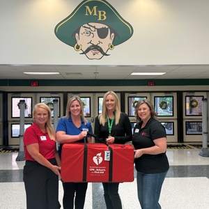 American Heart Association _ HTC staff present Myrtle Beach High School principal Kristin Altman with a CPR in Schools kit 