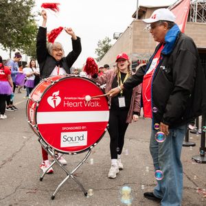 Stroke survivor bangs drum at Heart and Stroke Walk