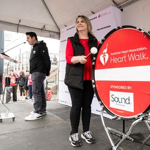Kyra Smithlin bangs the drum at the Heart and Stroke Walk