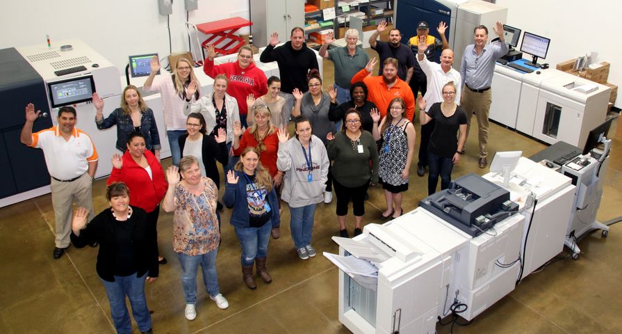 The i3logix team and Xerox presses The i3logix team and Xerox presses