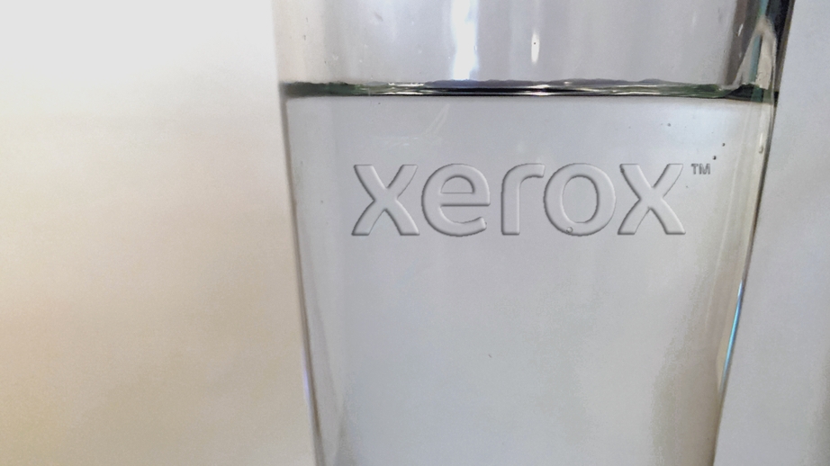 The Xerox logo appears in clear on a glass of water, symbolizing the Color of the Year 2020.