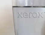The Xerox logo appears in clear on a glass of water, symbolizing the Color of the Year 2020.